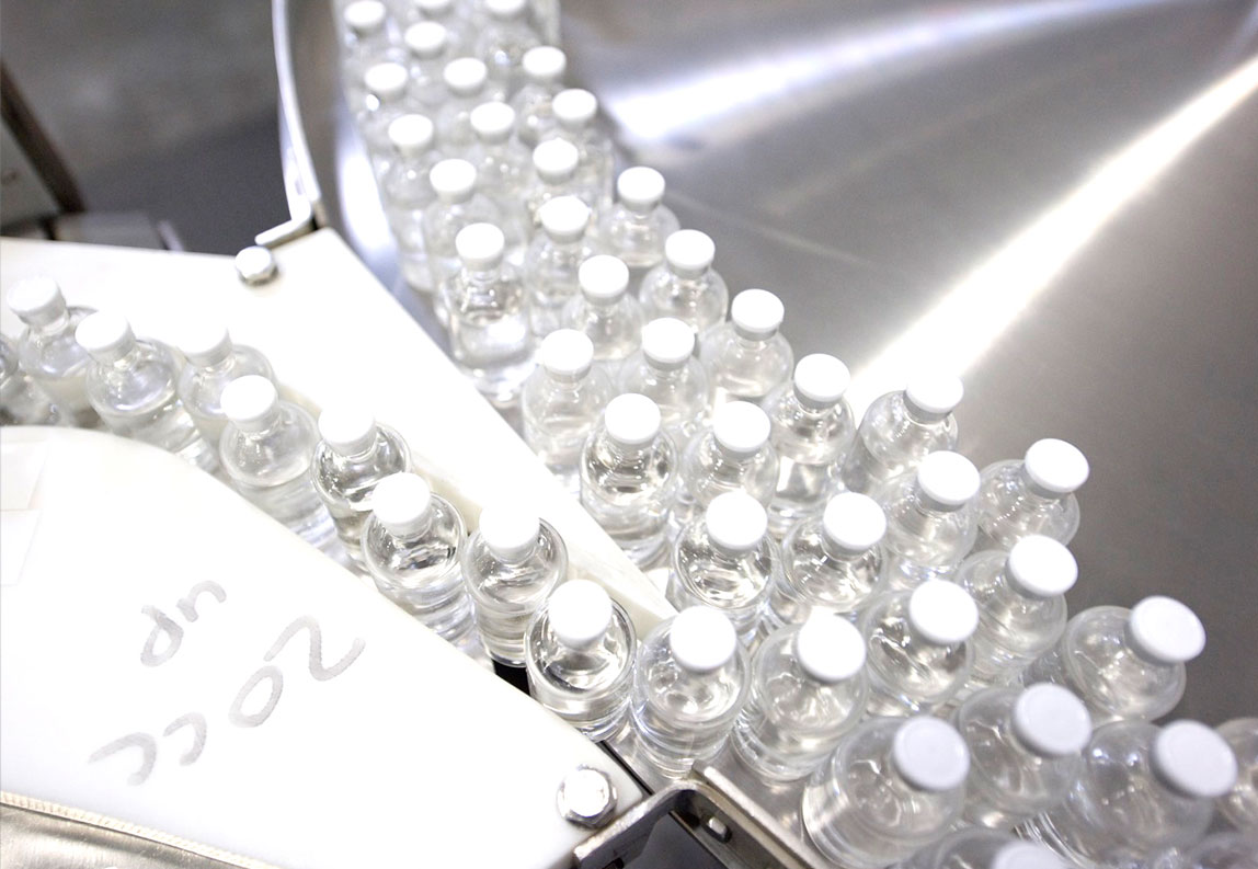 Amgen biotech vials being labeled.